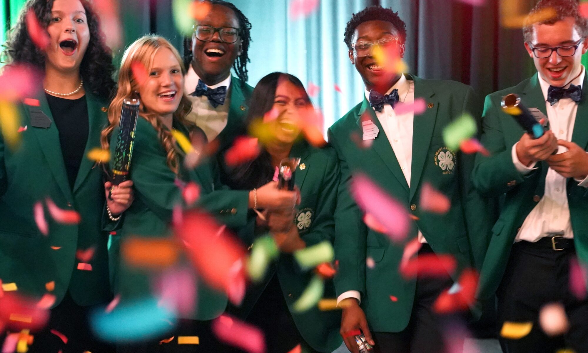 Georgia 4-H State Board members popping confetti cannons.