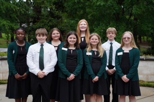 A group of eight students posing
