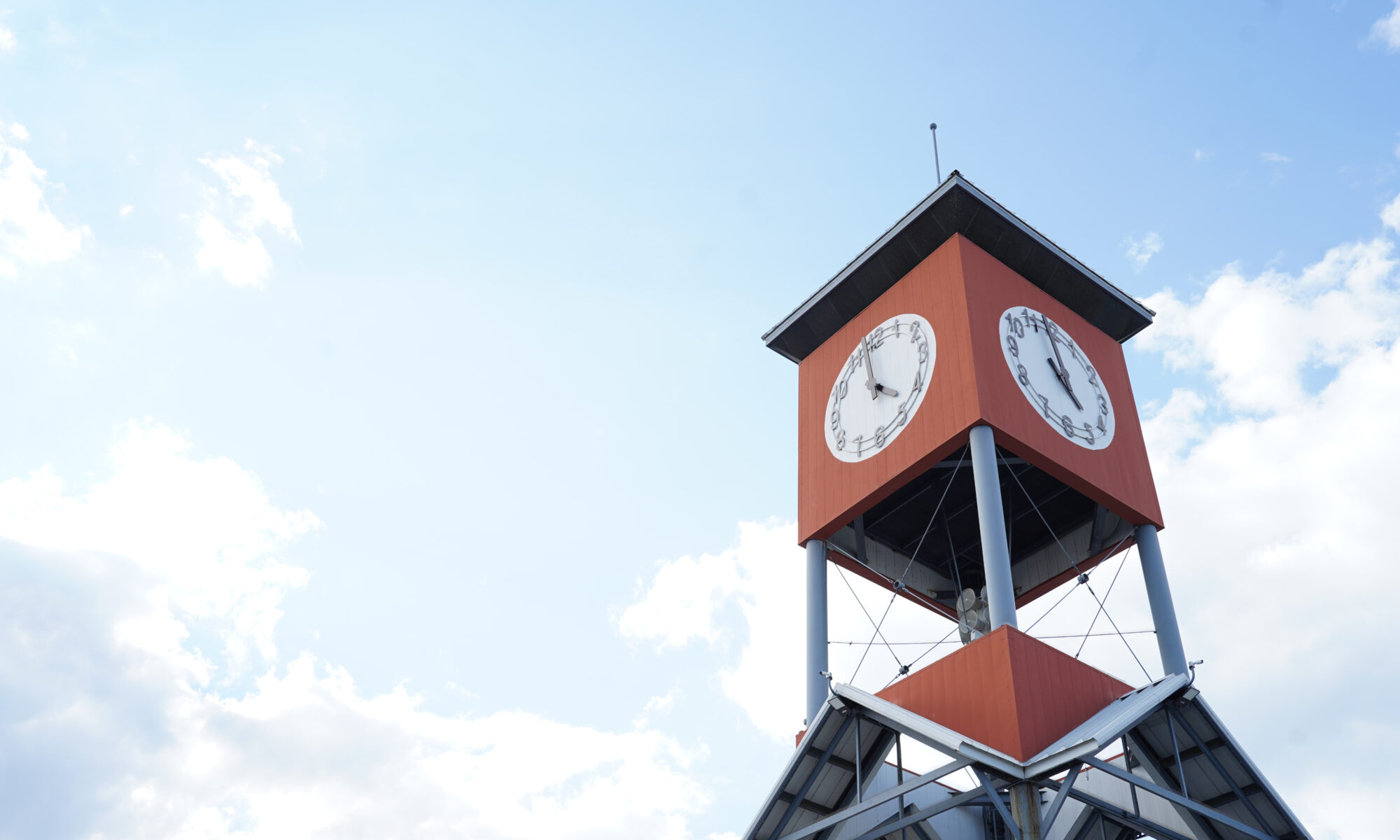 A clock tower against a blue sky at the Georgia National Fair