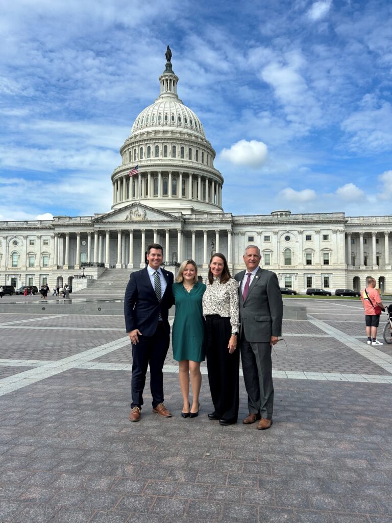 Adam Hammond, Georgia Simmons, Melanie Biersmith, and Randy Nuckolls standing