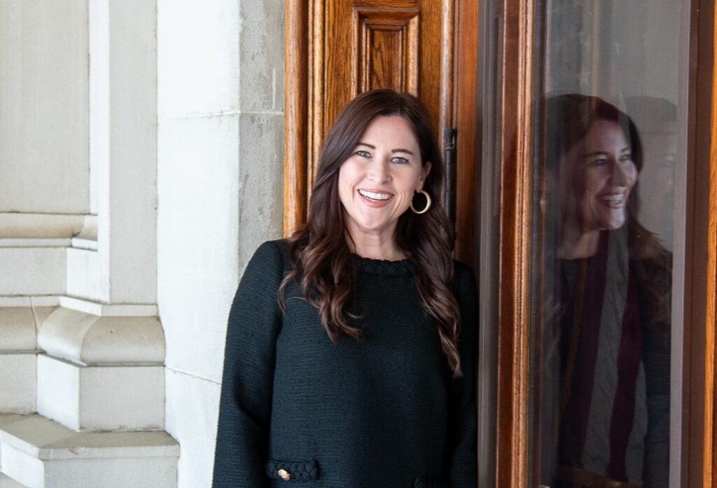 A headshot of Jenna Saxon in the Georgia capitol building